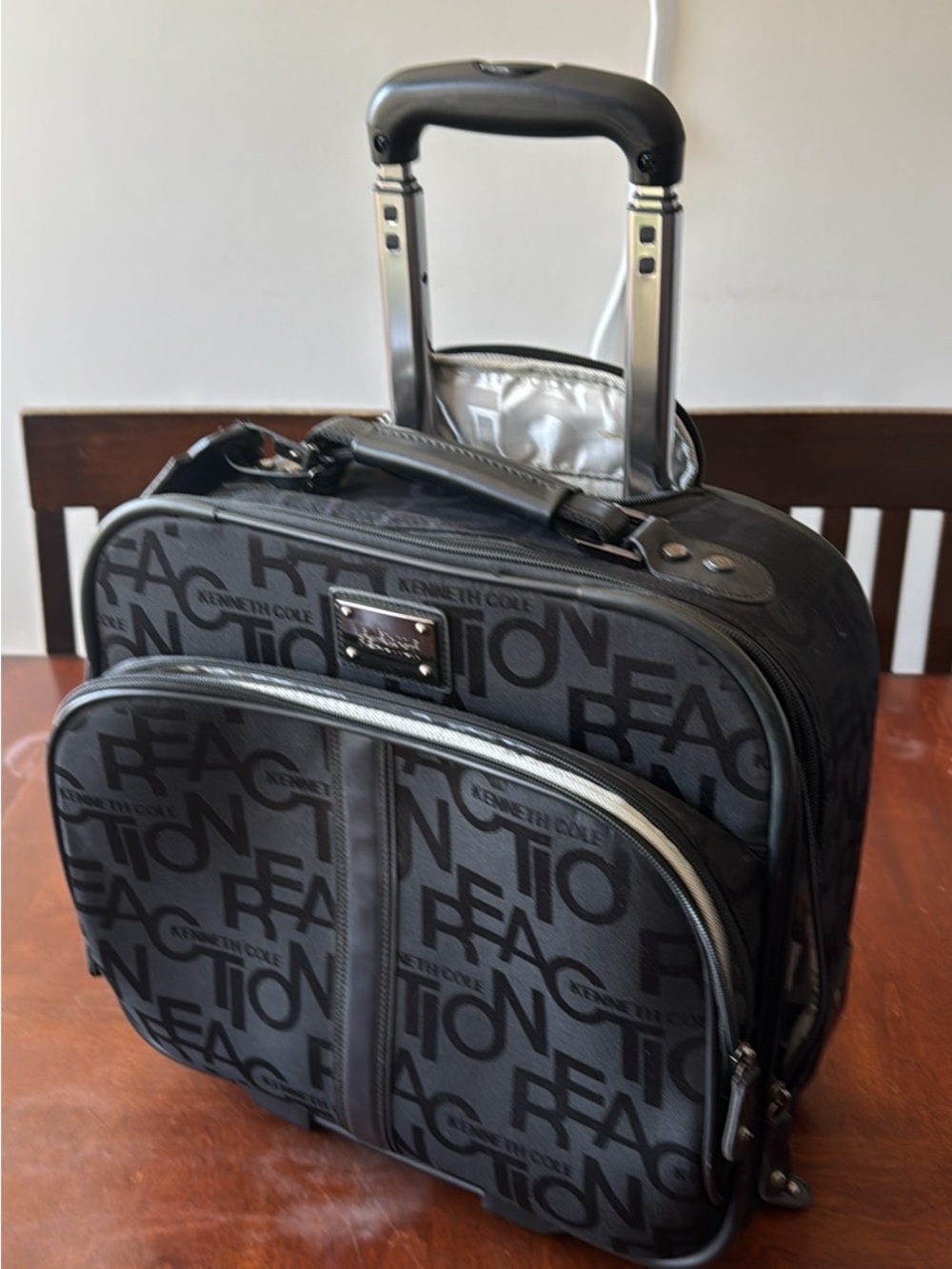 Kenneth Cole Reaction Black Logo Pattern carry on luggage
